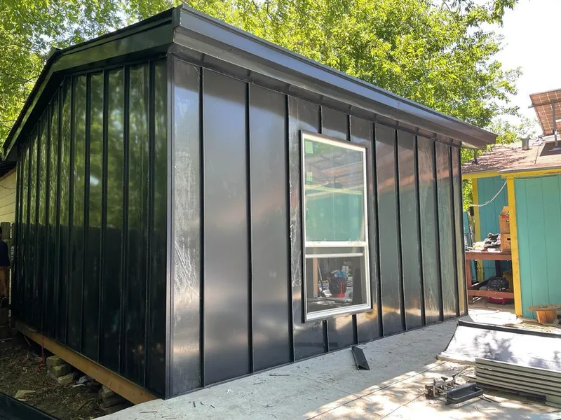 Black standing seam metal wall panels for Roof Inspection in Granite Shoals