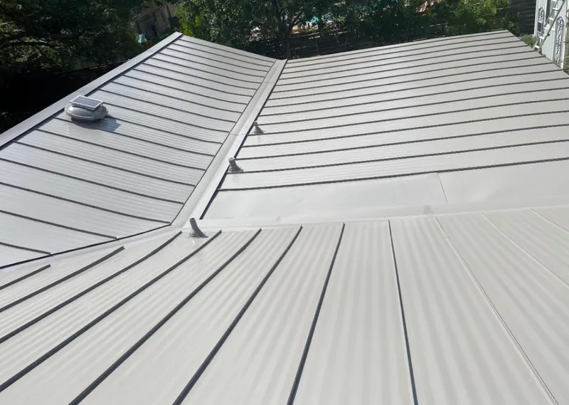 Solar attic fan installed on a metal roof for Roof Ventilation in Granite Shoals
